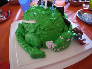 Dragon birthday cake in bright green.